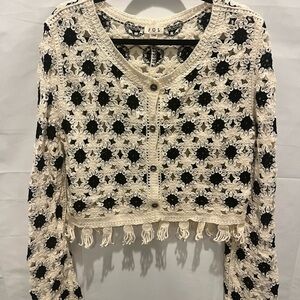Brand new POL Black and Cream Crochet Fringe Top with Bell sleeves.